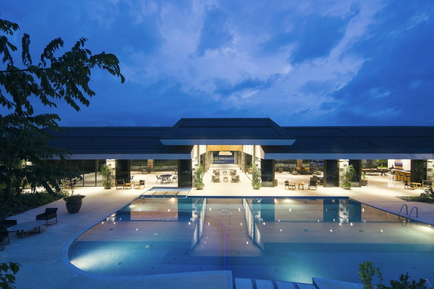 Illuminated resort pool at twilight