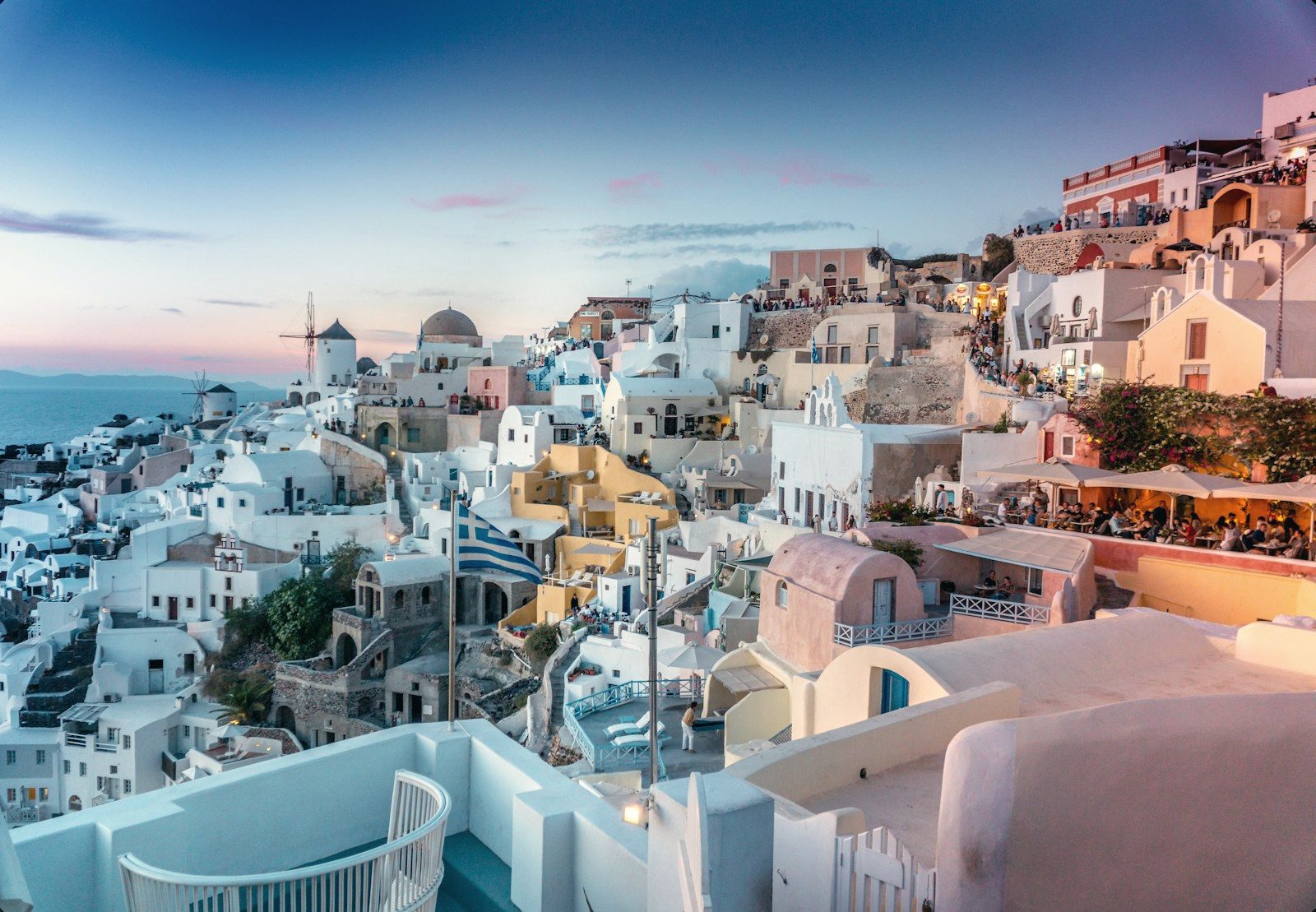 Whitewashed cliffside village in Santorini at dusk